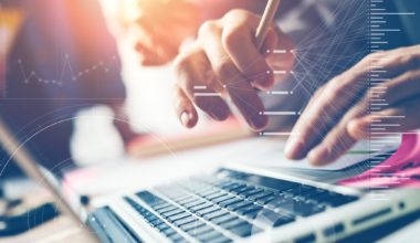 person typing on laptop