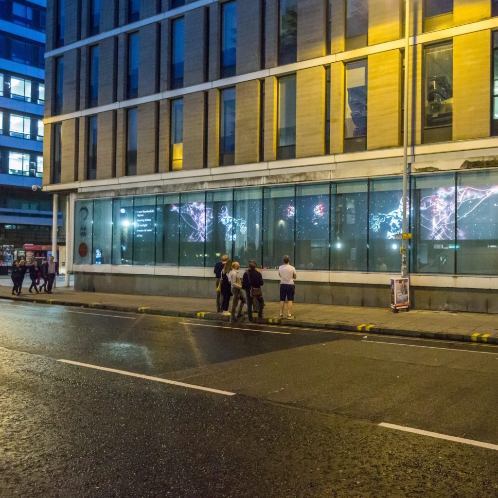 People looking at Bayes Centre