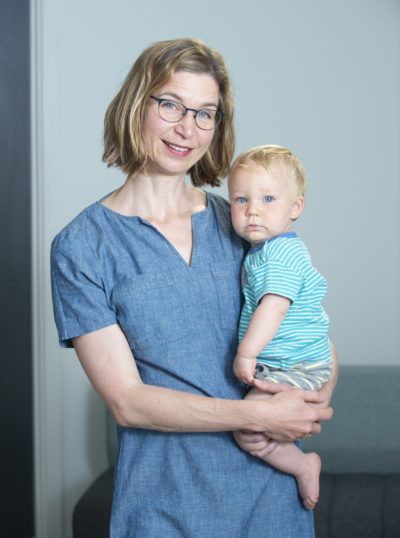 Professor Verena Rieser holding a child