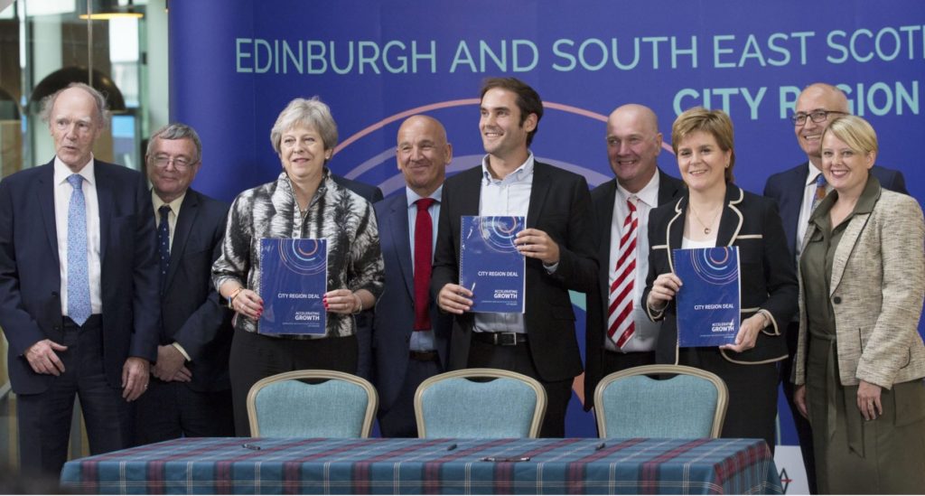 Image of the Ministers putting a seal on the city region deal