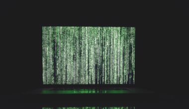 Dark computer code on green screen