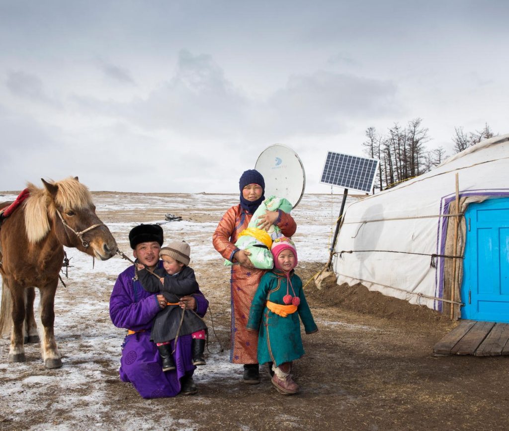Mother Delgermurun holds newborn Sugarmaa, outside their home in the northernmost area of Mongolia ©UNICEF